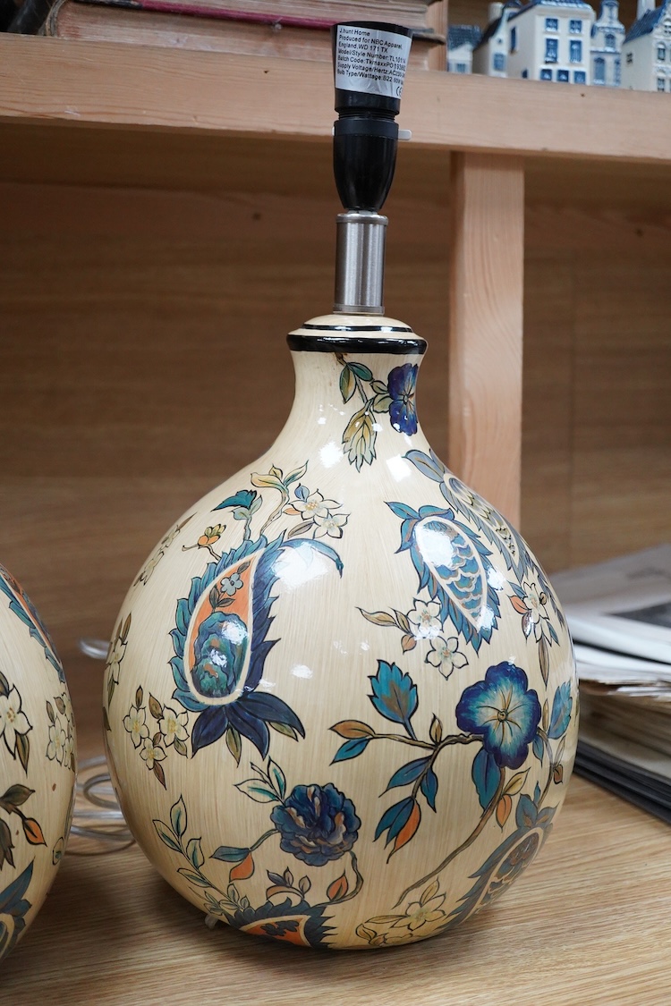 A pair of Persian inspired floral painted pottery table lamps, 33cm high